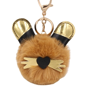Porte-clés chat en peluche kaki avec oreilles dorées et petit nez en cœur