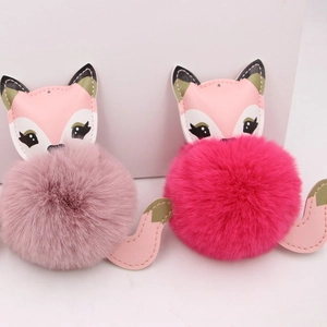 Cute faux fur fox keychains in pink and rose colors with leather details for bags