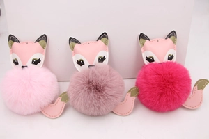 Three cute fox faux fur pompoms with PU leather details in various pink shades