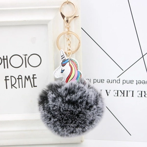 Unicorn keychain with gray and white faux fur pompom and golden metal clip
