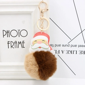Porte-clés Père Noël avec pompon en fausse fourrure bicolore marron et attache dorée