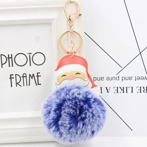 Porte-clés Père Noël avec pompon en fausse fourrure bleu foncé et anneau doré