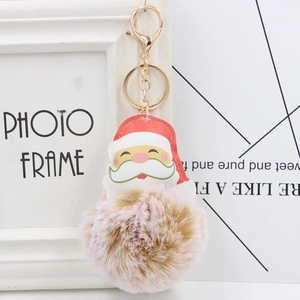 Porte-clés pompon en fourrure rose-brun avec motif Père Noël et mousqueton doré