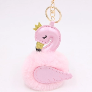 Detailed view of pink swan plush ball keychain with golden crown and lobster clasp