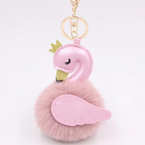 Detailed view of pink flamingo pompom keychain with gold sequins and metal hardware