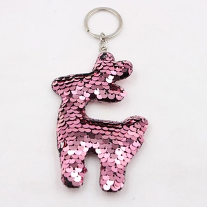 Pink purple sequined animal keychain with silver metal ring on white background