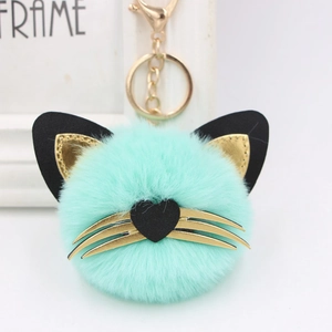 Cute mint green plush cat puff keychain with faux leather ears and golden heart-shaped nose