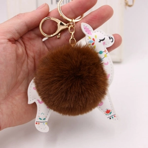 Plush deer keychain with white PU leather, ethnic patterns and a fluffy brown fur ball