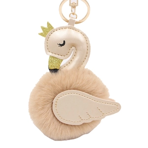 Elegant champagne swan plush pompom keychain with PU leather wings and gold crown