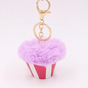 Creative purple plush cupcake keychain with red and white striped base and gold alloy clip