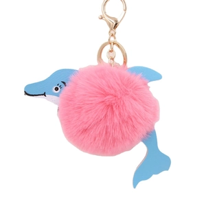 Pink fur pompom dolphin plush keychain with blue leather accents and golden metal clip