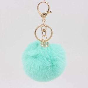 Mint green faux fur keychain with gold geometric crystal cage and lobster clasp