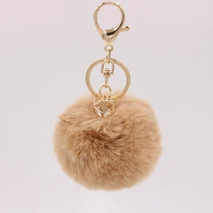 Detail of 8cm camel faux rabbit fur pom pom keychain with crystal pendant and gold clip