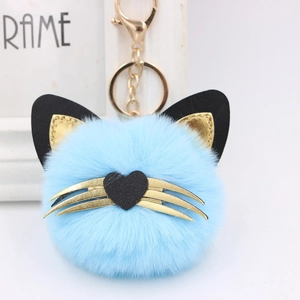 Cute sky blue cat plush ball keychain with golden leather ears and heart nose details