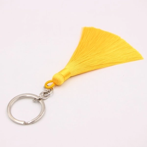 Bohemian style yellow tassel keychain with woven ring and silver metal clasp for handbags