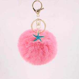 Pink faux fur pompom keychain with golden lobster clasp and blue starfish charm for bags