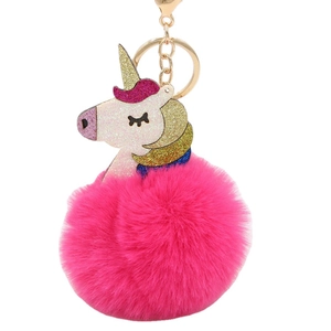 Colorful unicorn pom pom keychain with pink faux fur and golden sequin details