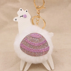 Portachiavi con lama carino con pompon bianco e sella di paillettes rosa brillanti