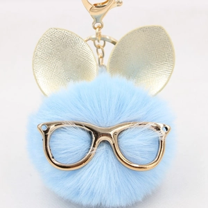 Porte-clés créatif en fausse fourrure bleu clair avec oreilles de lapin dorées