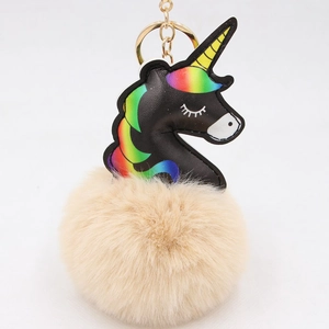 Cute black PU unicorn keychain with large camel fur pompom and golden metal ring