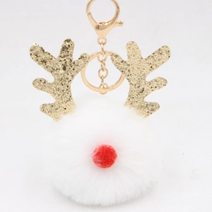 Detail of Christmas white pompom keychain with gold glitter antlers and red nose charm