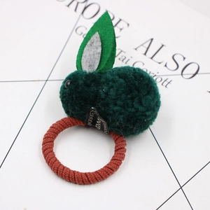 Detailed close-up of dark green plush bunny hair tie with felt ears and woven elastic band