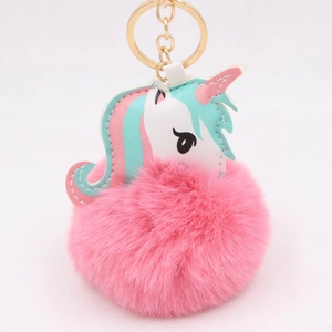 Cute unicorn plush keychain with soft pink fur ball and golden metal ring