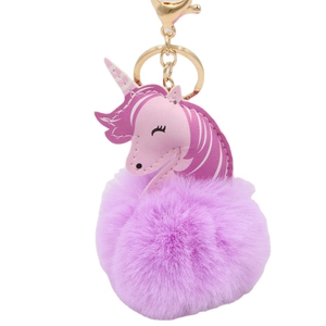 Cute unicorn plush keychain featuring a purple faux fur ball and gold metal ring