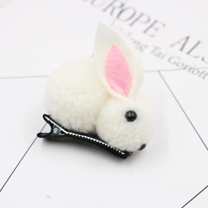Detail of cute cream white plush bunny hair clip with pink ears and metal duckbill clip