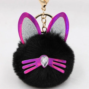 Detail of black plush cat keychain with sequin ears and teardrop crystal nose detail