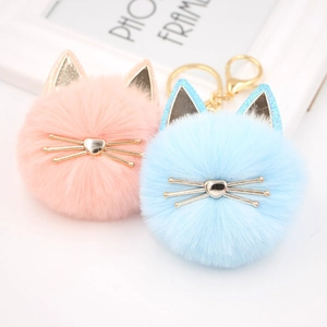 Cute plush cat ball keychain set in pink and blue with sparkly ears and metal whiskers