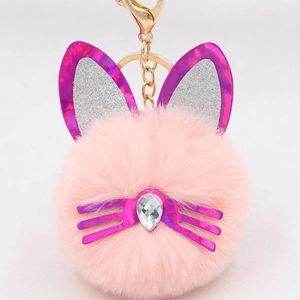 Pink plush cat ear keychain with purple sequin details and gold metal lobster clasp