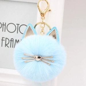Light blue cat pom-pom keychain with gold hardware and glitter ears for handbags