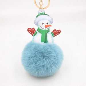 Close-up of snowman PU leather charm with light blue fluffy pom pom and golden lobster clasp