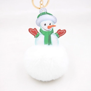 Christmas snowman keychain with white faux fur pompom and gold metal clasp on white background
