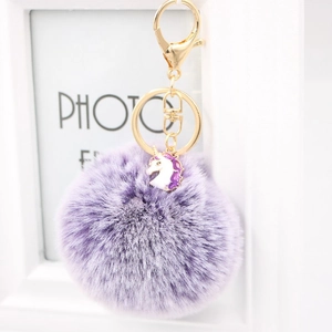 Unicorn alloy keychain with fluffy purple fur pom pom and gold lobster clasp for bags