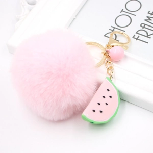 Pink plush ball keychain with watermelon slice pendant and golden hardware for bags