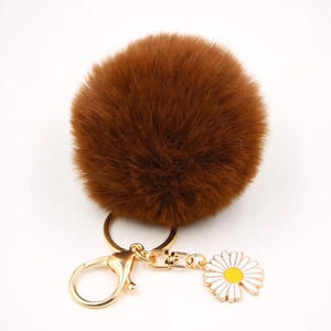 Détails de porte-clés pompon marron avec breloque marguerite et fermoir doré