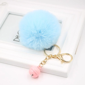 Light blue faux fur pom pom keychain with gold chain and pink bell Christmas gift charm