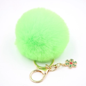 Porte-clés pompon vert fluo en fausse fourrure avec flocon de neige et anneau doré