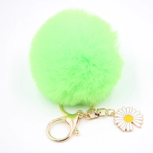 Porte-clés pompon vert citron en fausse fourrure avec breloque marguerite et fermoir doré