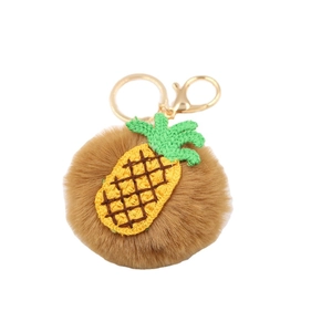 Mignon porte-clés pompon ananas en fausse fourrure avec anneau doré et feuilles vertes