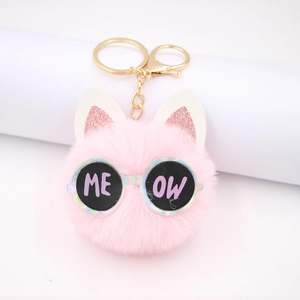 Pink plush cat head charm with glitter ears and meow sunglasses on golden keychain