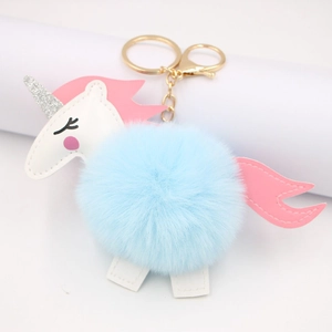 Fashionable unicorn pompom keychain with light blue faux fur and gold metal ring