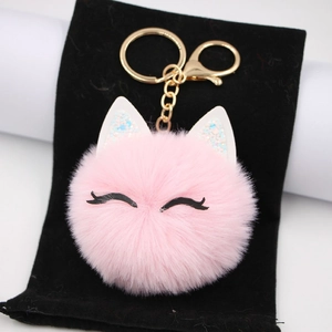 Pink plush cat eyelash keychain with artificial rabbit fur ball and golden lobster clasp