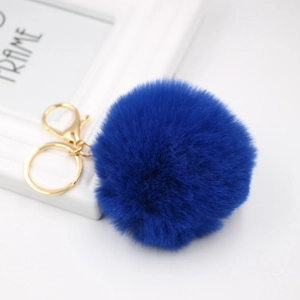 Detail of the royal blue fluffy faux rabbit fur keychain with golden lobster clasp