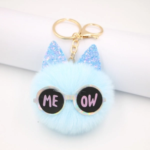 Light blue faux fur cat ball keychain with glitter ears and meow sunglasses decor