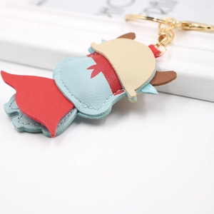 Luffy style cartoon PU leather keychain with gold ring and lobster clasp on white desk