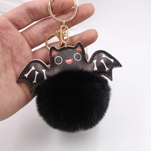 Halloween black faux leather bat pompom keychain with white skeleton wings pattern