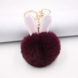 Portachiavi creativo con orecchie di coniglio e pompon in morbida pelliccia viola